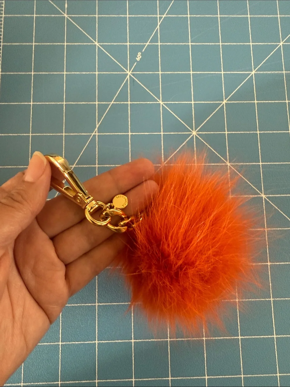 Michael Kors Orange Fur Pom Pom Bag Charm with Gold Hardware